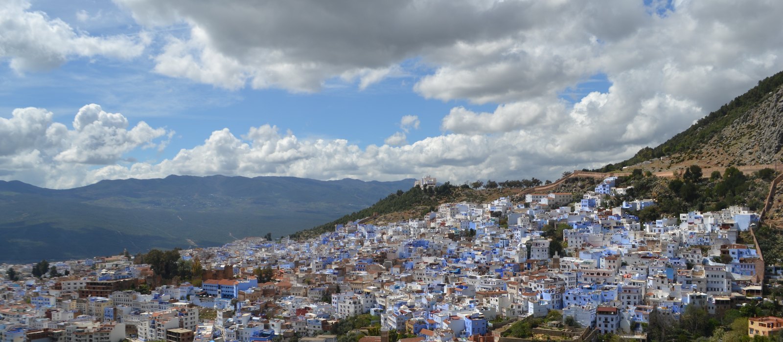 Chefchaouen's blue-painted town spilling down a hillside in the Rif Mountains